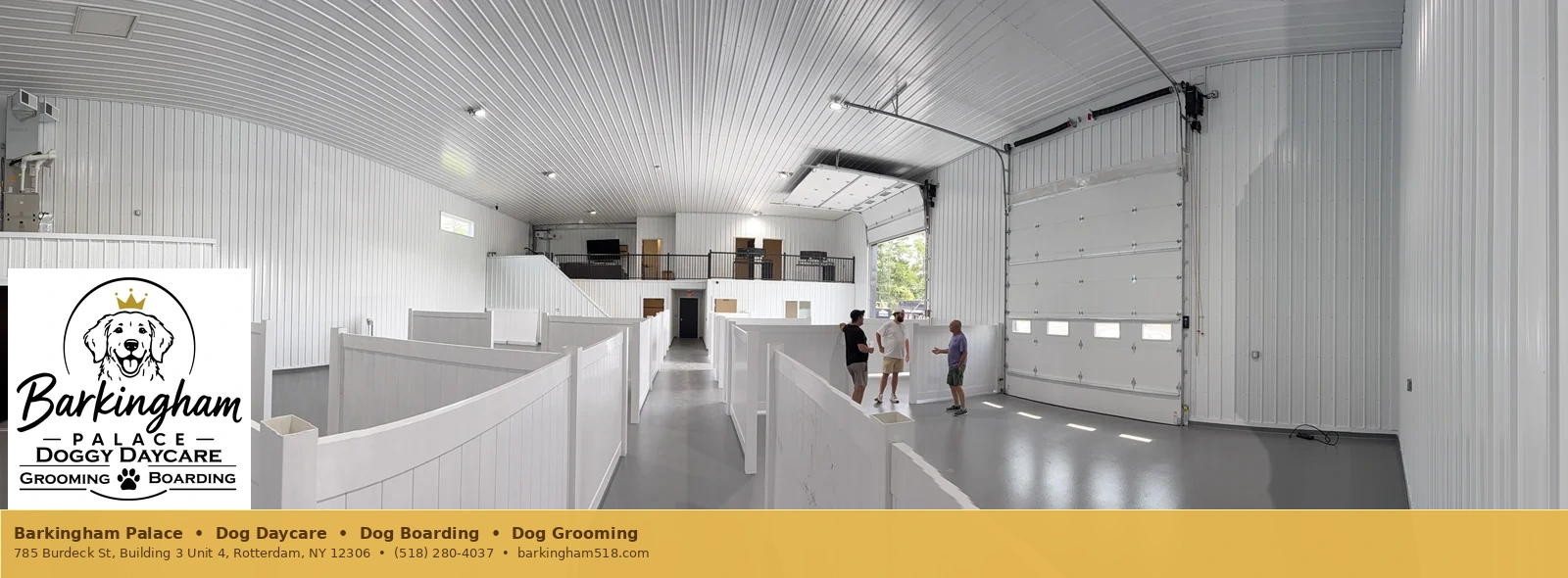 Wide interior view of bright suite partitions at Barkingham Palace dog care facility in Rotterdam, NY