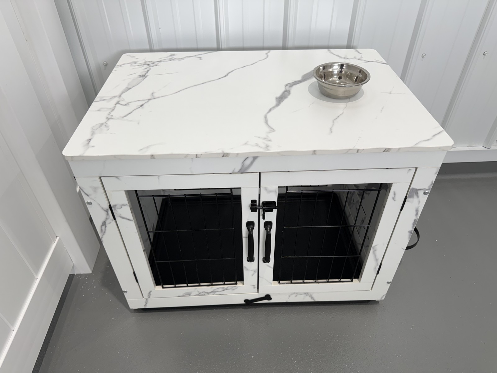 Finished marble-top double boarding kennel in the overnight-care area at Barkingham Palace in Rotterdam, NY